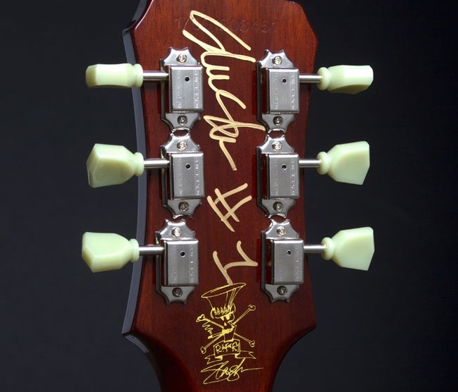 100 Hand-signed and numbered by Slash Custom Hard Shell Case with “Skull & Tophat” logo Custom Leather Strap Weight relieved Mahogany Body Carved Hard Maple Cap with AAA Flame Maple Veneer Seymour Duncan “Slash” Humbuckers Tone controls with Sprague “Orange Drop” capacitors